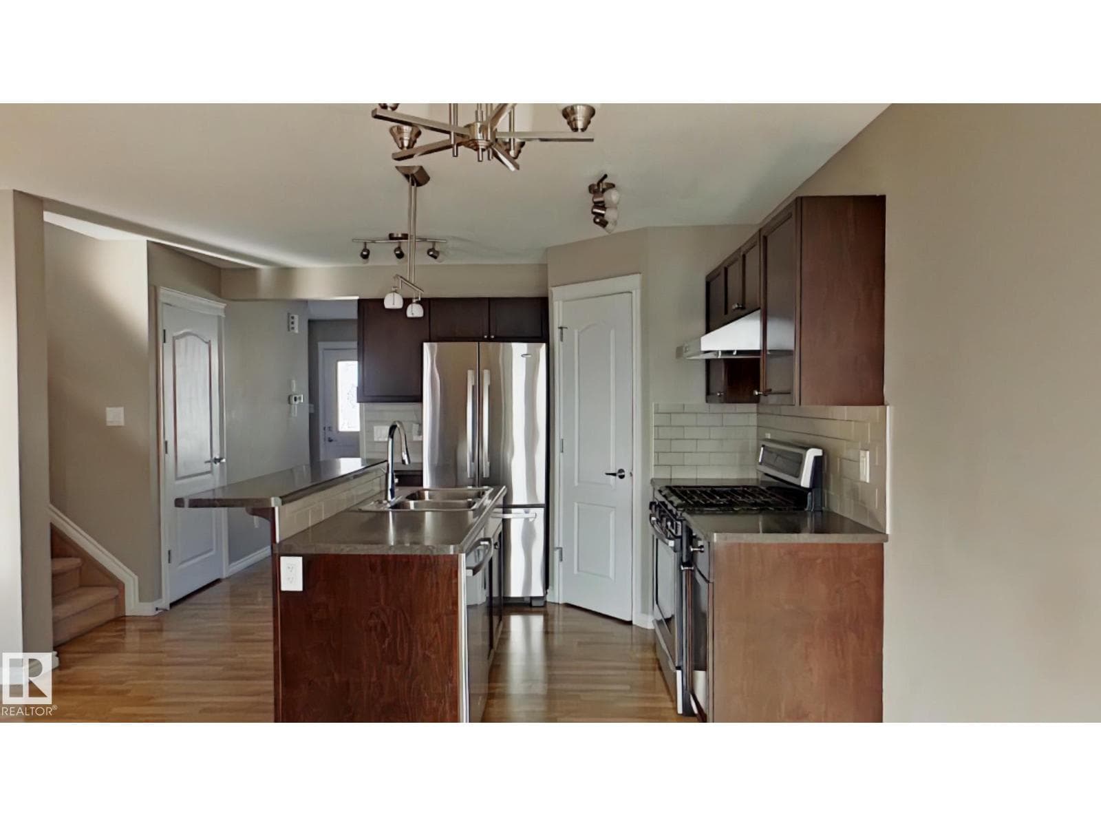 7665 Schmid CR NW — photo 1 of 8